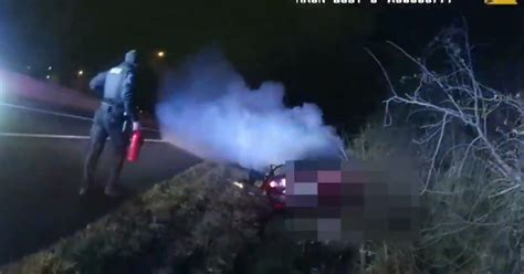WATCH: Police lieutenant pulls unconscious driver from burning truck